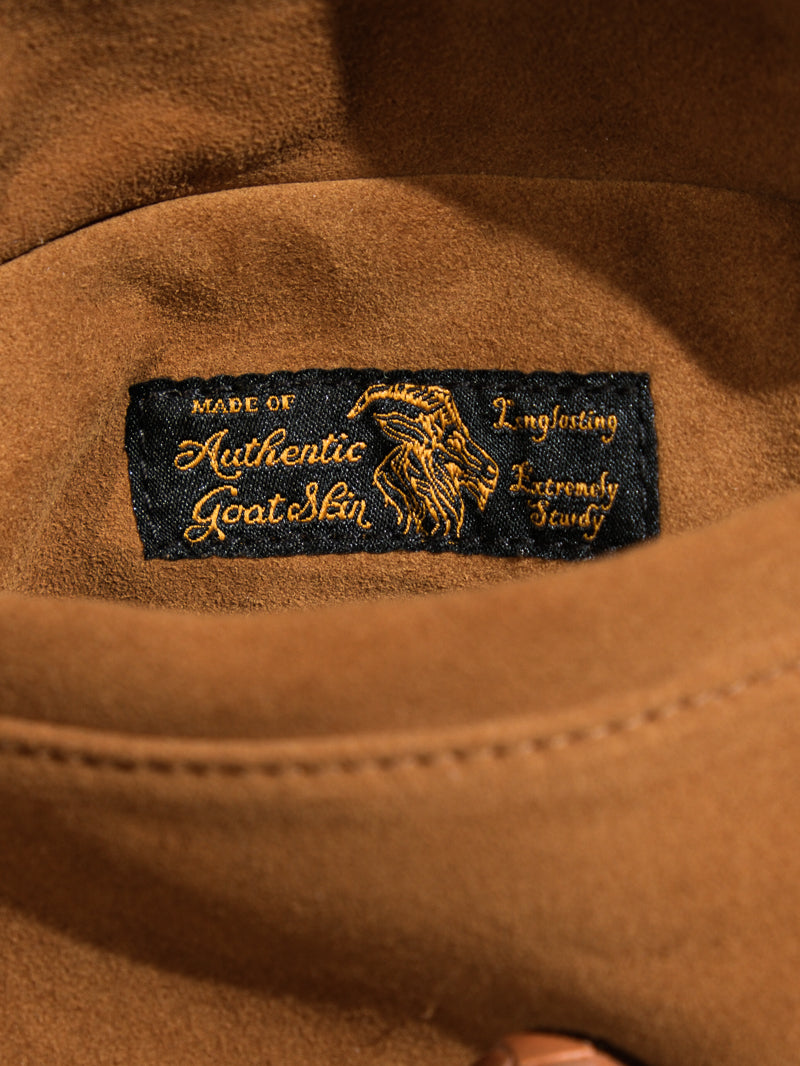 Brown woven label on farmers leather jacket