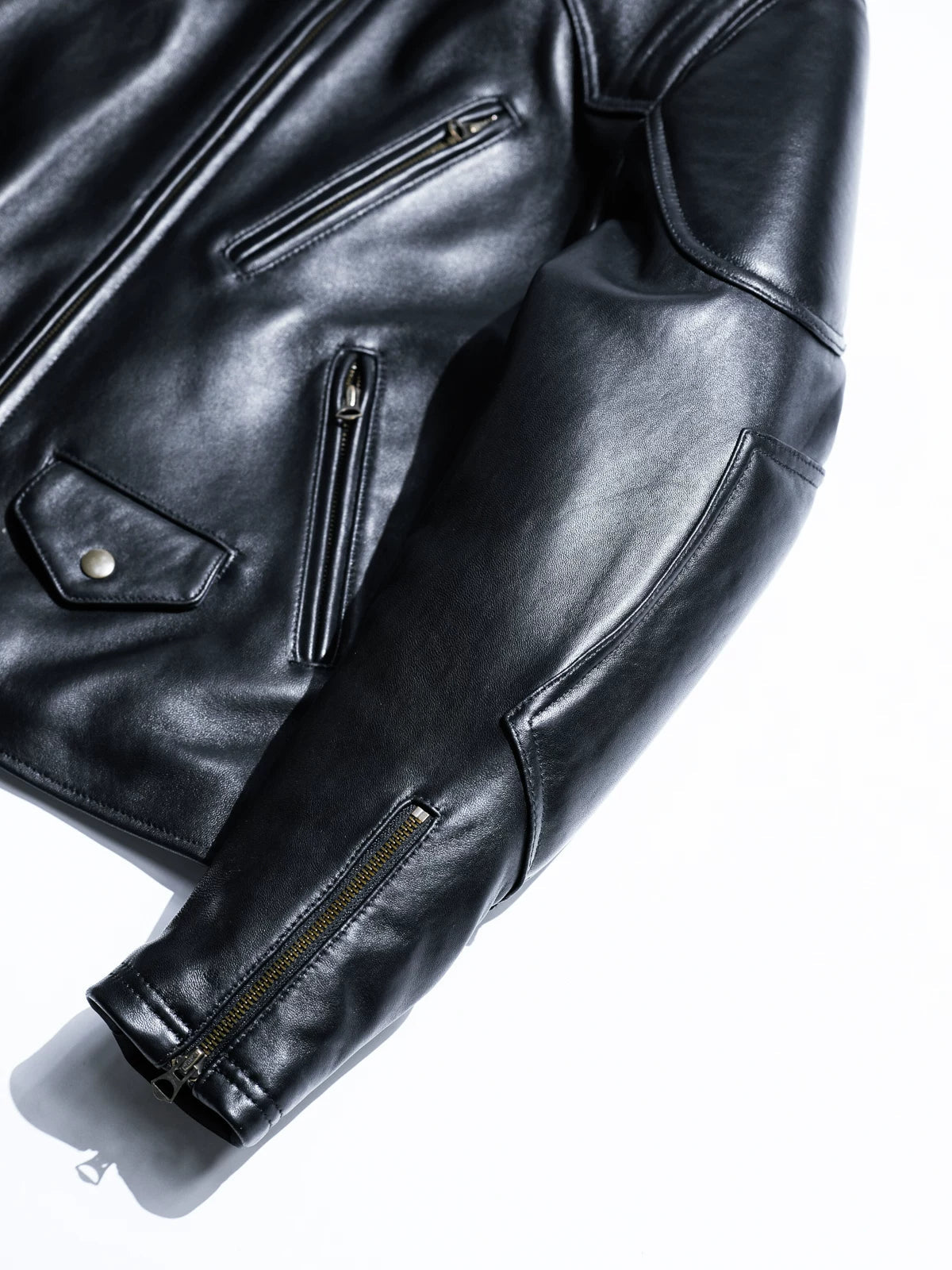BRIXTON black jacket sleeve and chest pocket detail with zippers