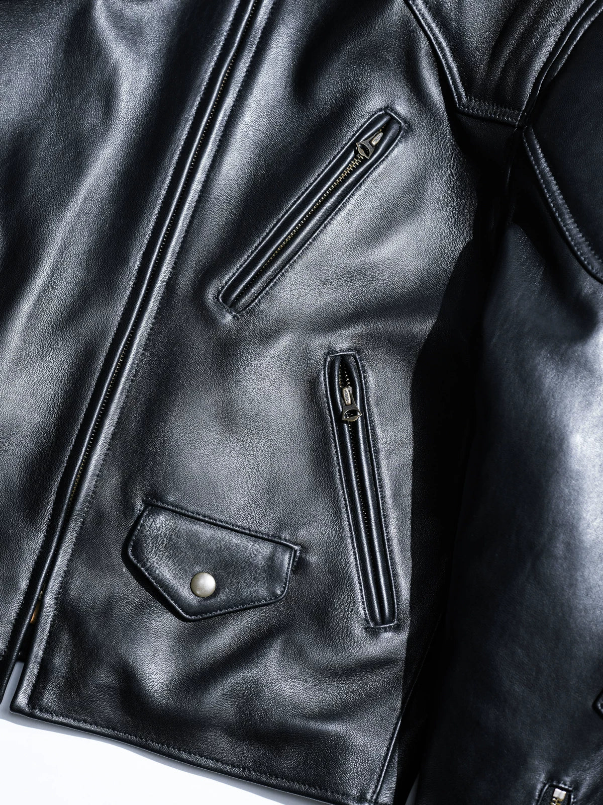 BRIXTON padded racing jacket in black sheepskin, front detail with zip and flap pockets