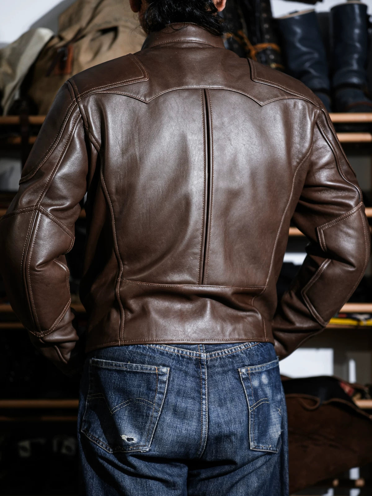 Rear three-quarter view of BRIXTON brown jacket with elbow panels and back seams