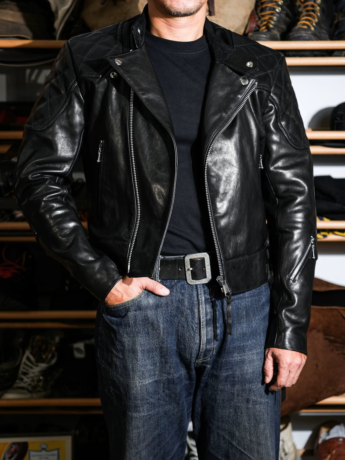 MALLORY IMOLA racing jacket styled with blue denim, front three-quarter look in black oiled-wax calfskin