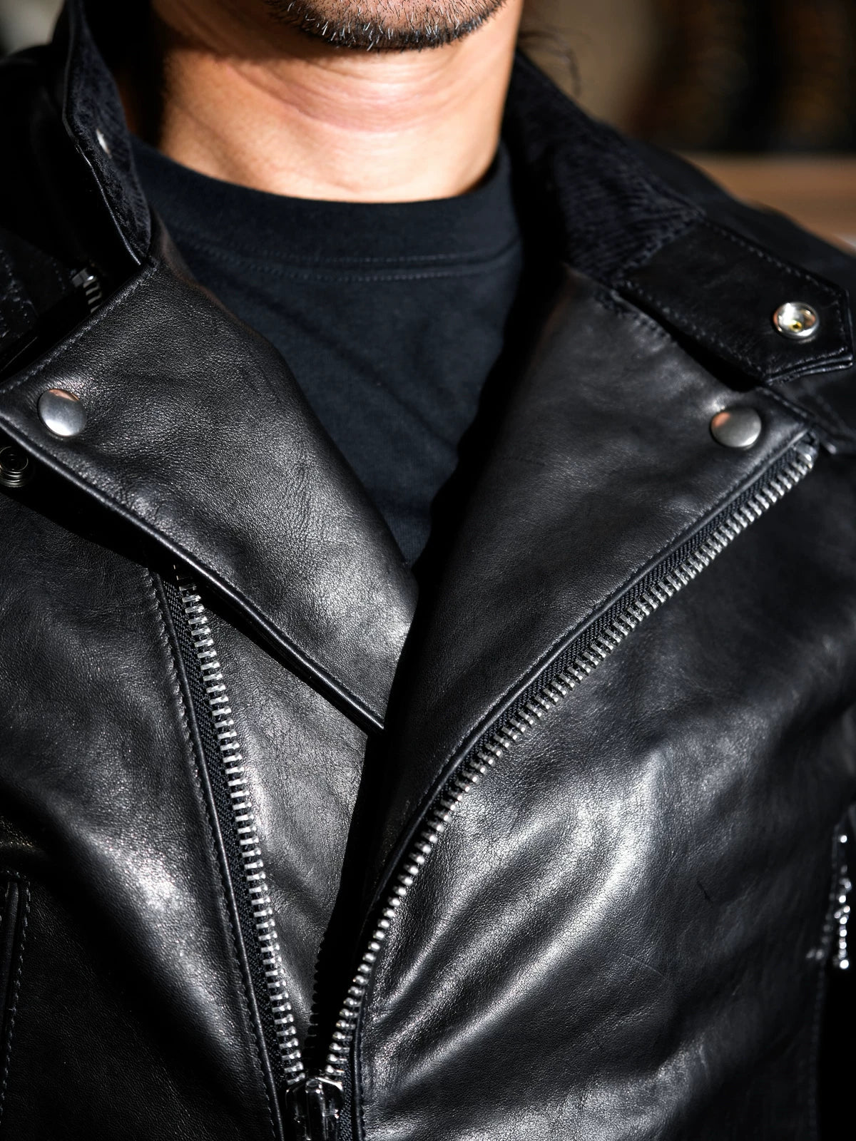 Close-up of the MALLORY IMOLA jacket chest with YKK snap buttons and vintage metal zipper pull