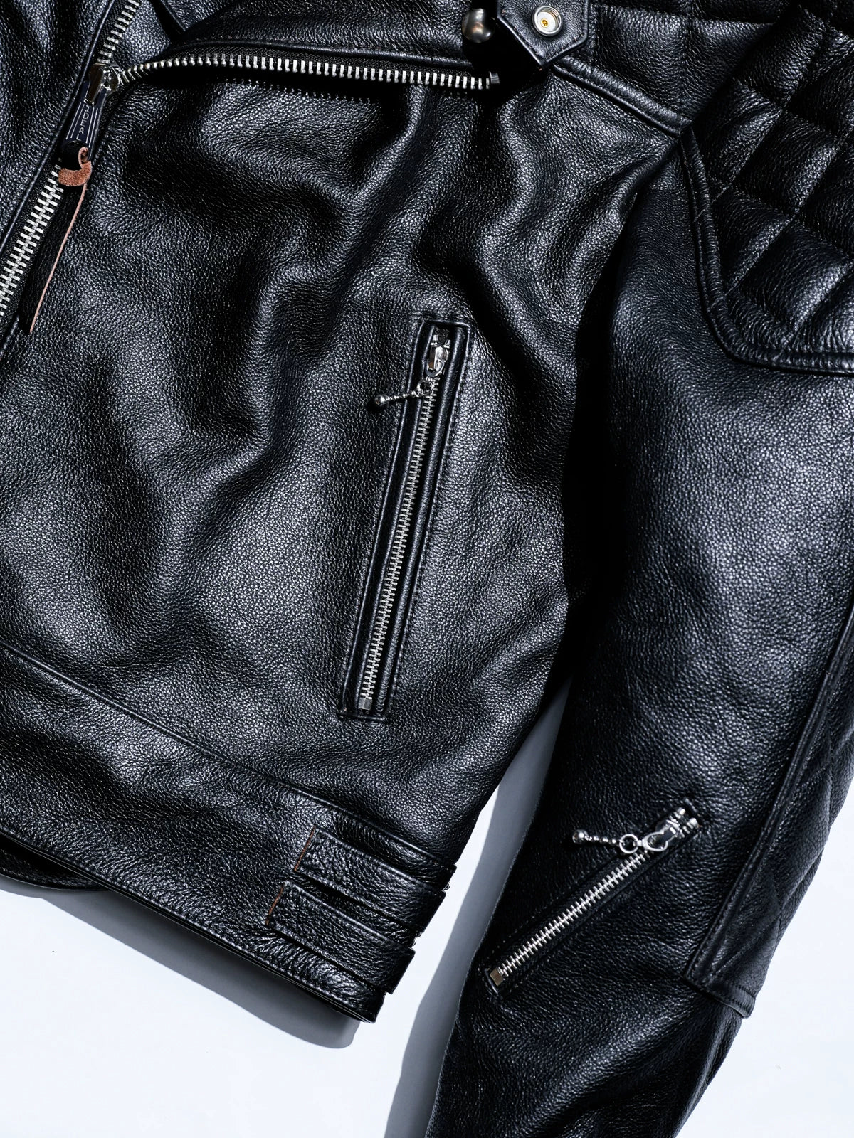 MALLORY IMOLA front and sleeve detail with chest zip pocket, sleeve zipper and leather straps