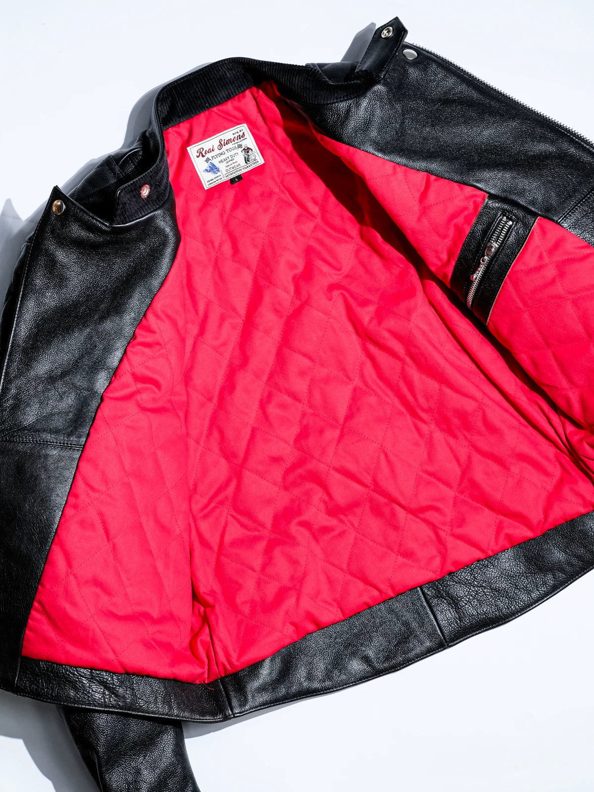 MALLORY IMOLA jacket laid flat revealing red quilted lining, corduroy collar facing and vintage woven label