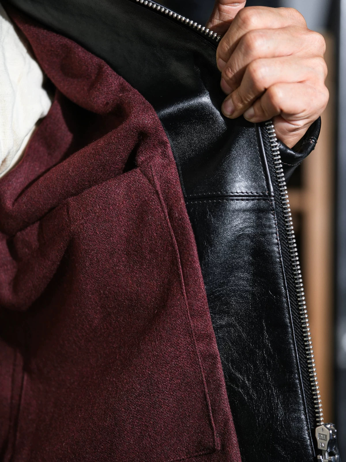 Mojave jacket opened to reveal the wine-toned wool-blend lining
