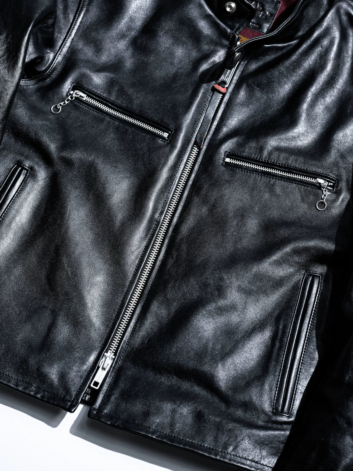 Mojave jacket front detail with YKK zips and red pull accents