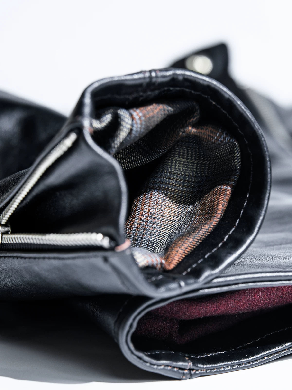Mojave jacket cuff interior with check lining and metal zipper