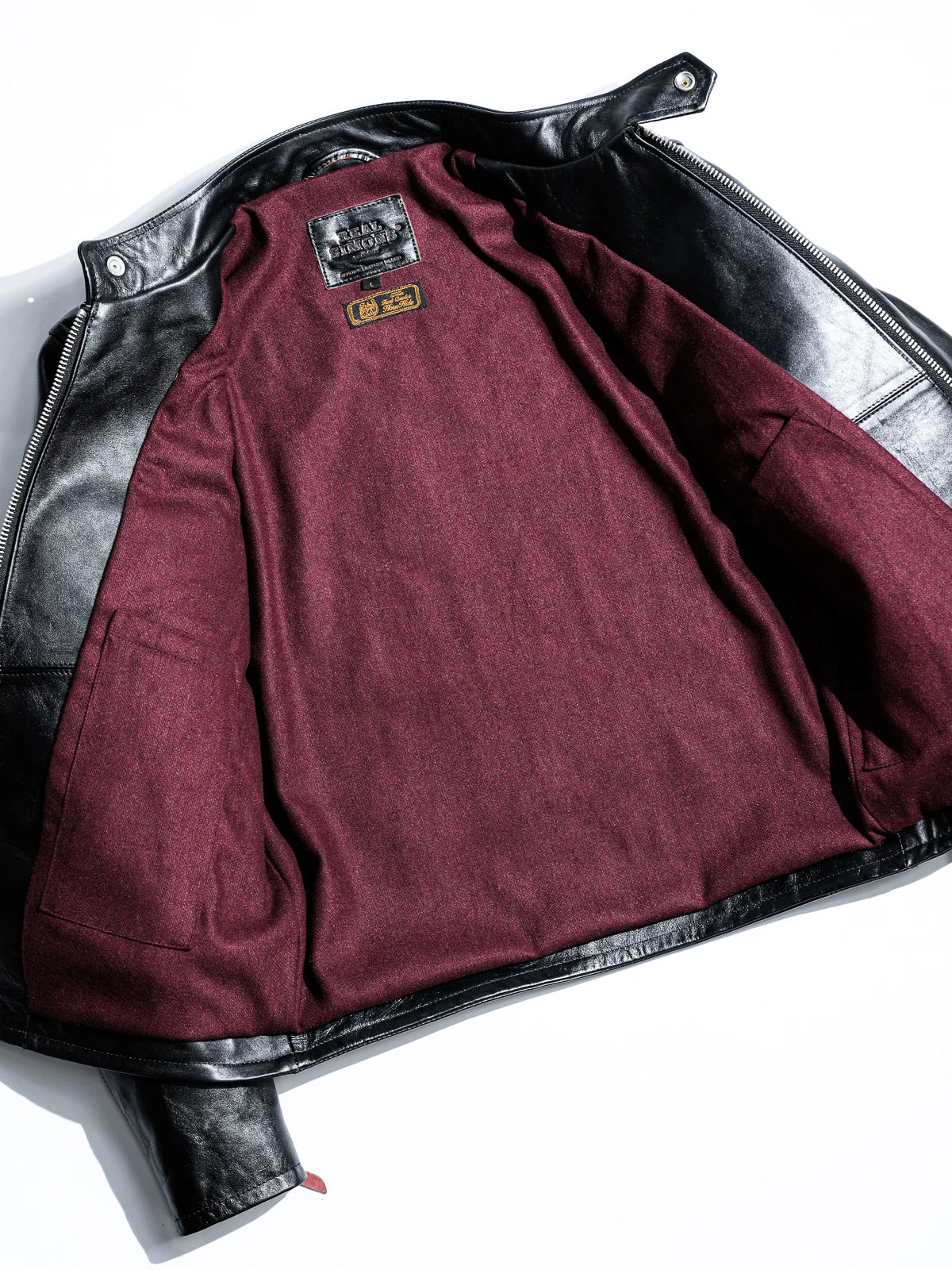 Inside of the Mojave jacket with wine wool-blend lining and Real Simons labels