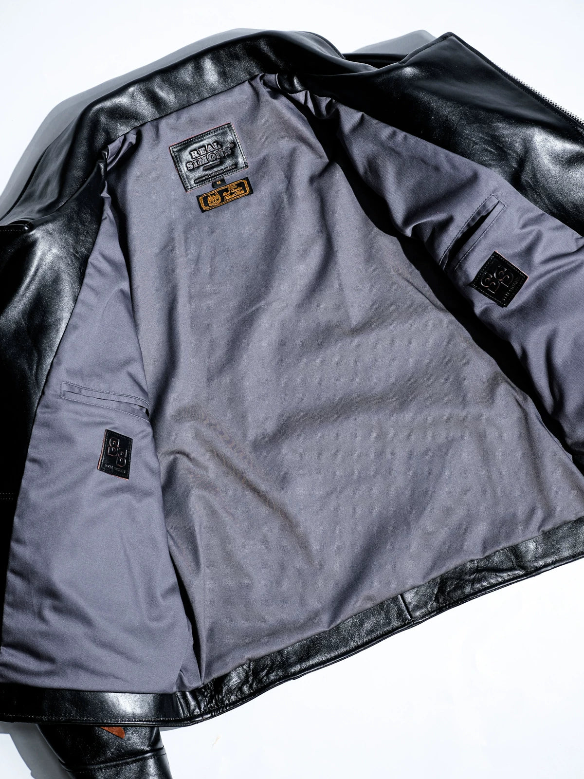 Full interior view of heavy grey TC cotton-blend twill lining with interior pockets and SS leather tabs