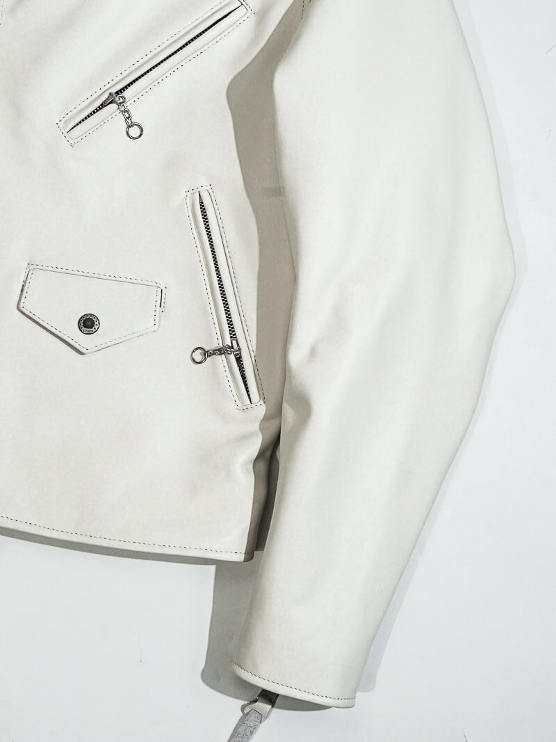 White jacket front pocket detail with zip and snap closures