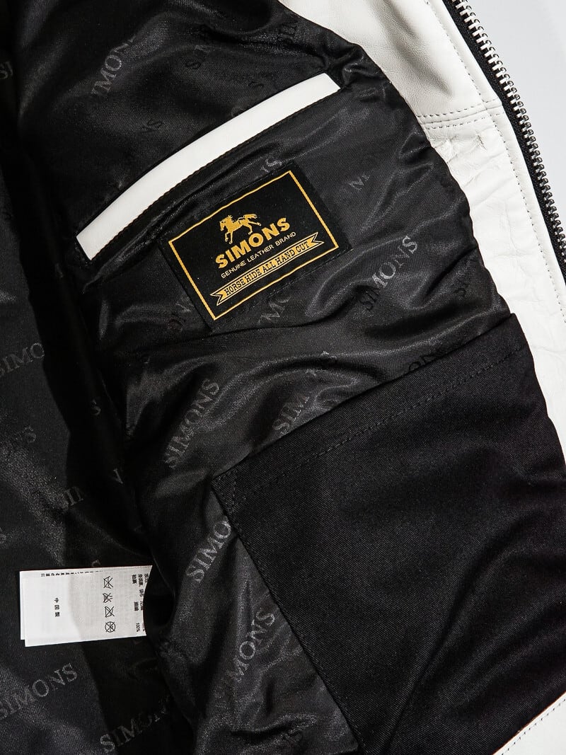 White jacket lining with Real Simons leather label and wash tag