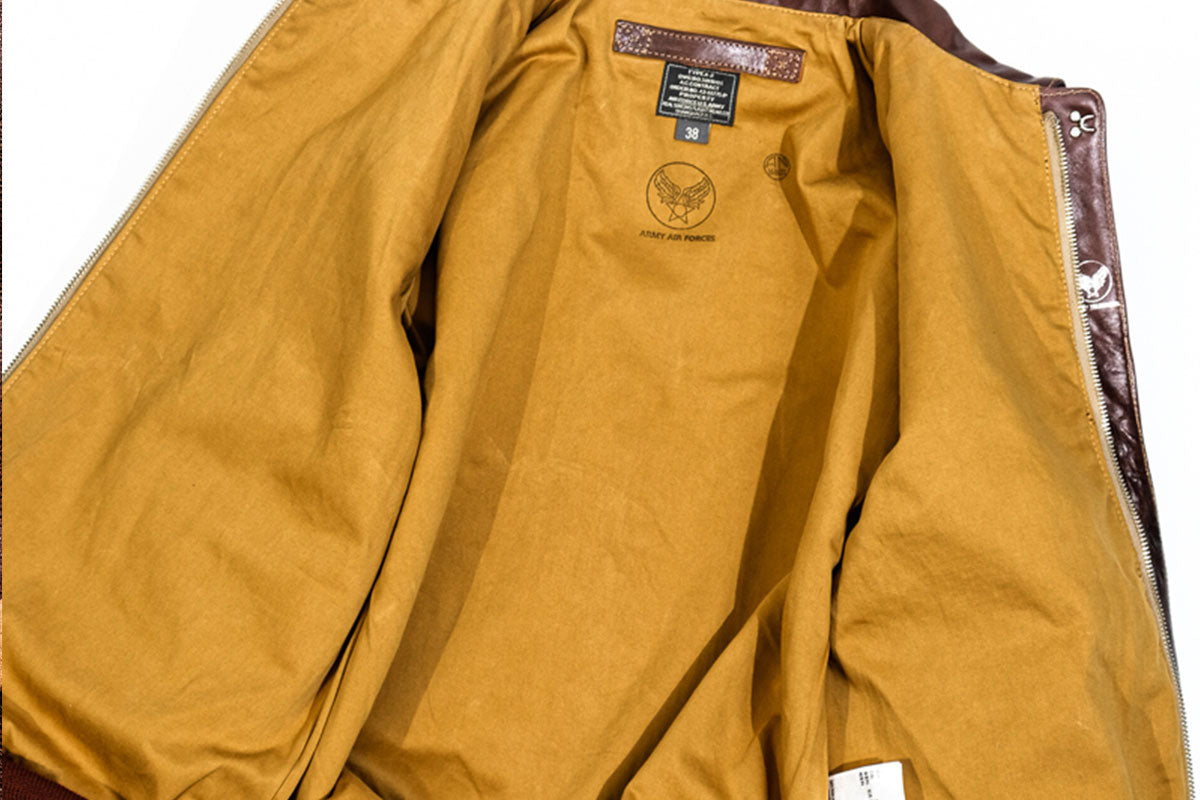 Mustard yellow cotton interior lining of the Real Simons 18775 A-2 leather bomber jacket