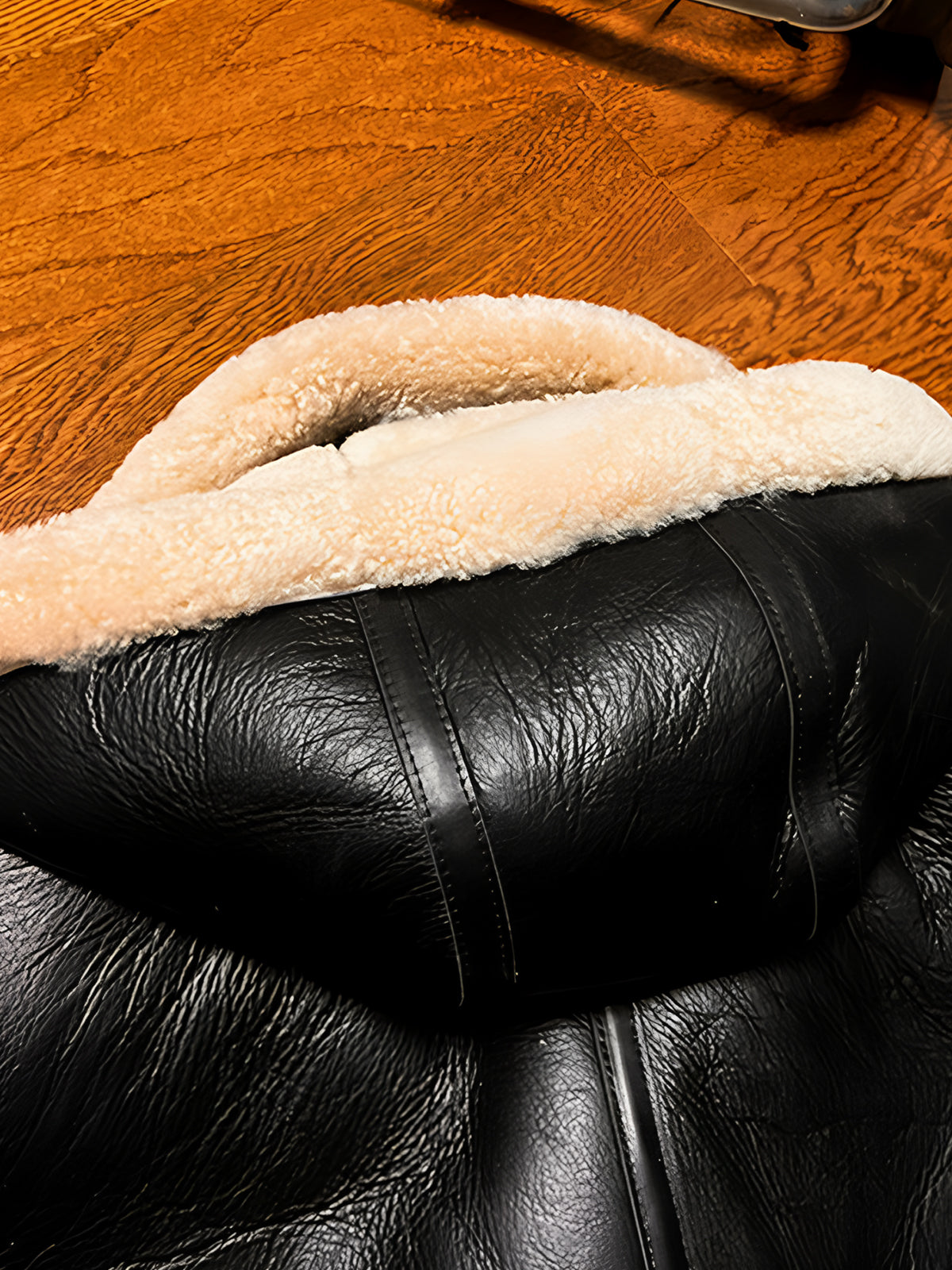 Black-sheepskin-jacket-with-hood-on-the-back