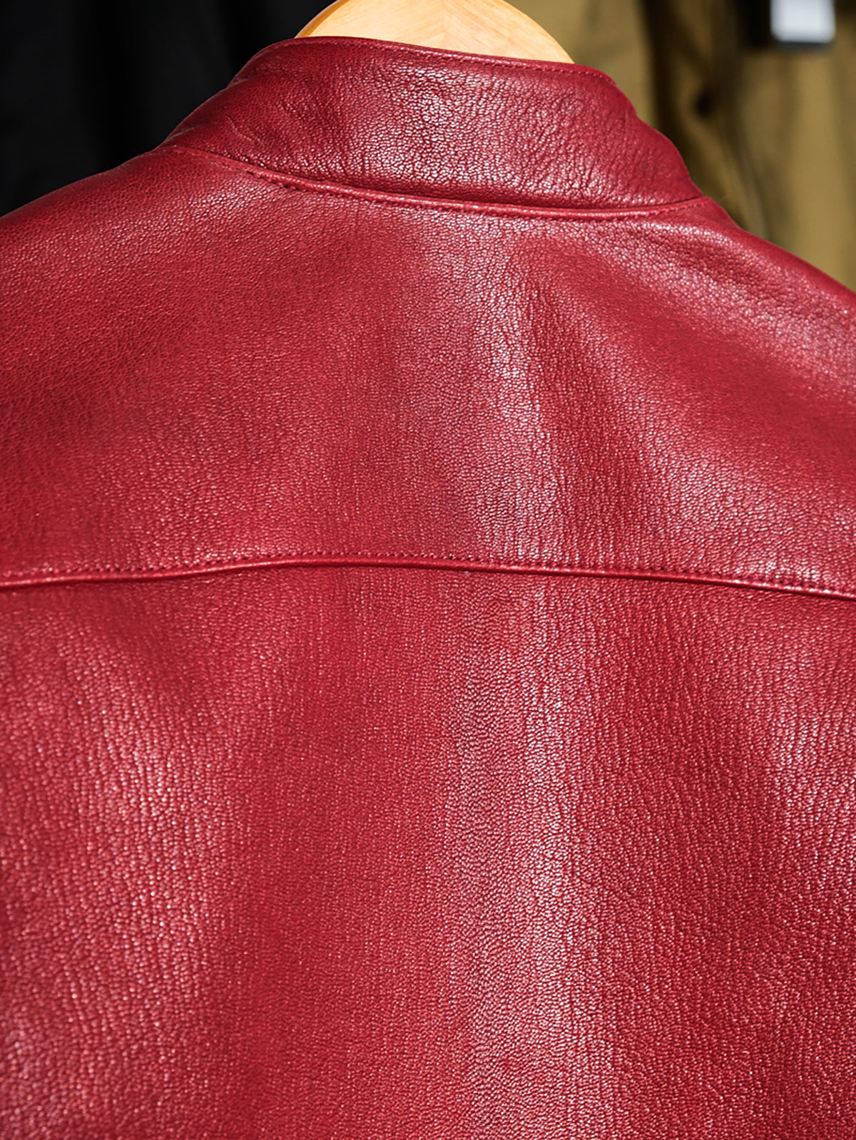 Goatskin-leather-cafe-racer-jacket-with-red-collar-lining.