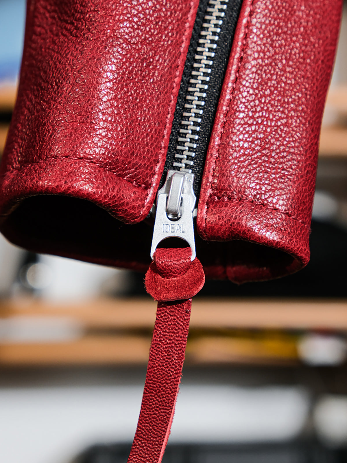 Goatskin-leather-cafe-racer-jacket-with-red-cuffs-and-zippers.