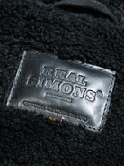 black trademark on a farmers leather jacket