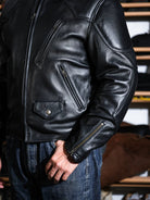 BRIXTON black jacket front detail with chest zip pocket, waist flap pockets and snap closures
