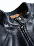 BRIXTON jacket stand collar with single dot button and metal zipper, studio detail
