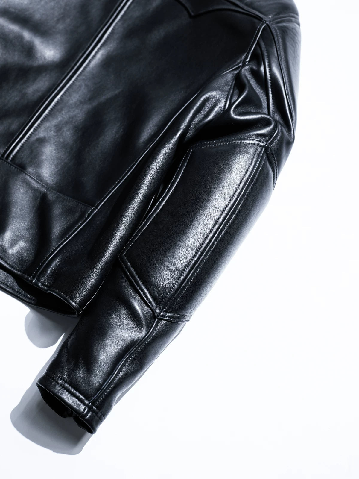 BRIXTON black jacket sleeve and body seam detail showing stitching