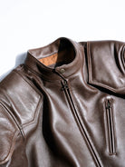 BRIXTON brown jacket collar, dot button and chest zipper, studio detail