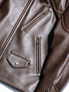 BRIXTON padded jacket in brown sheepskin, front detail with zip and flap pockets