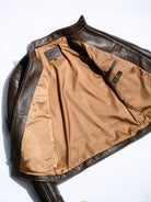 Inside of BRIXTON brown jacket with light camel lining and Real Simons leather label