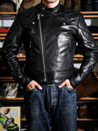Real Simons MALLORY British racing jacket IMOLA in black oiled-wax calfskin, front view with diamond-quilted shoulders and offset zipper