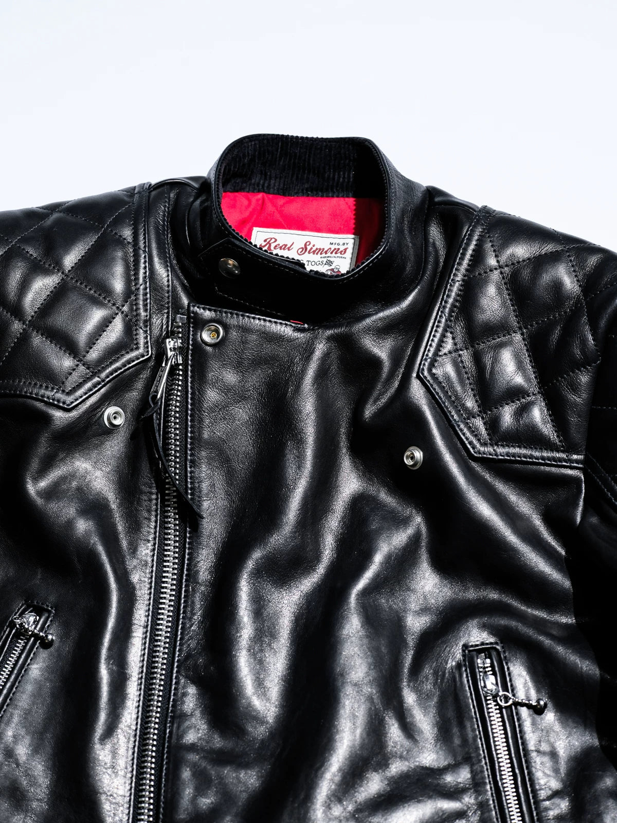 Close-up of the MALLORY IMOLA stand collar, metal zipper and snap-button placket