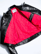 MALLORY IMOLA jacket laid flat revealing the red diamond-quilted lining and vintage woven label