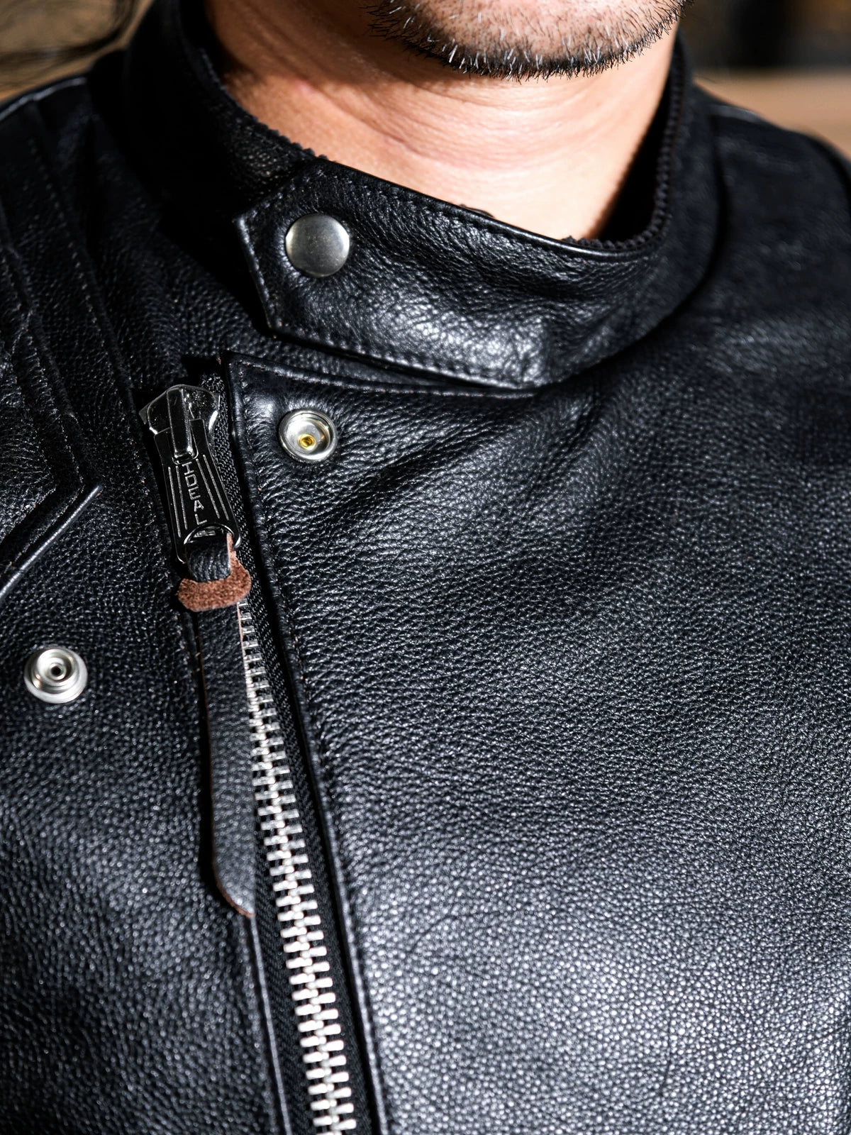 MALLORY IMOLA collar and placket detail with metal snap buttons and IDEAL front zipper