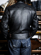 Back view of the MALLORY IMOLA tea-core cowhide jacket with quilted sleeves and side waist adjusters