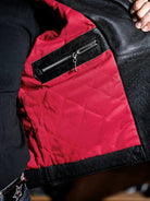 Inside of the MALLORY IMOLA jacket with red diamond-quilted lining and interior leather zip pocket