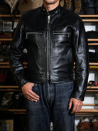 Mojave racing jacket in tea-core horsehide worn with jeans, front view showing stand collar and zip pockets