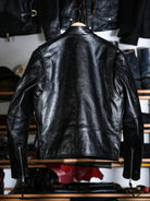 Back view of the Mojave jacket on a hanger with zipped cuffs