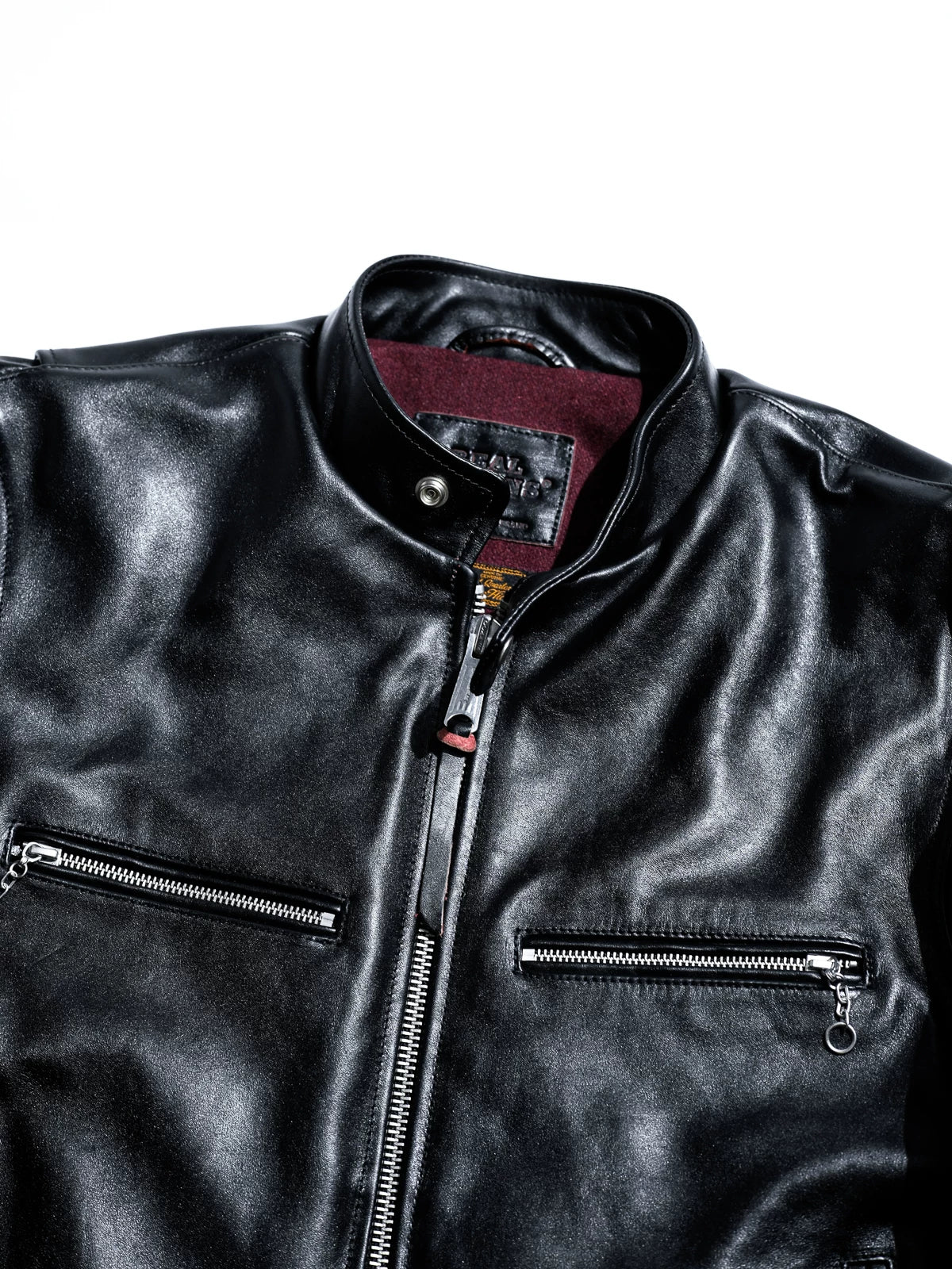 Mojave jacket collar, snap and zip pull detail with wine lining