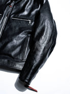Mojave jacket sleeve, chest pocket and hem zip detail with red leather tail