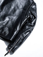 Mojave jacket sleeve zipper detail with black leather pull and red accent