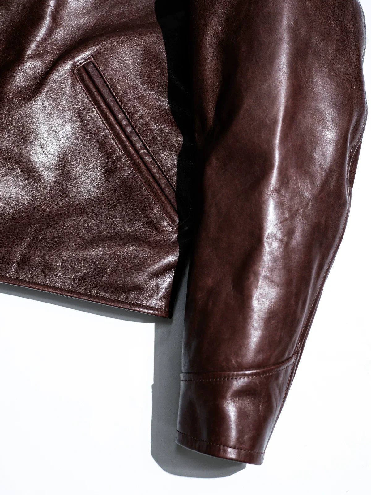 Angled muff pocket and shirt cuff construction detail in seal brown horsehide