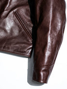 Angled muff pocket and shirt cuff construction detail in seal brown horsehide
