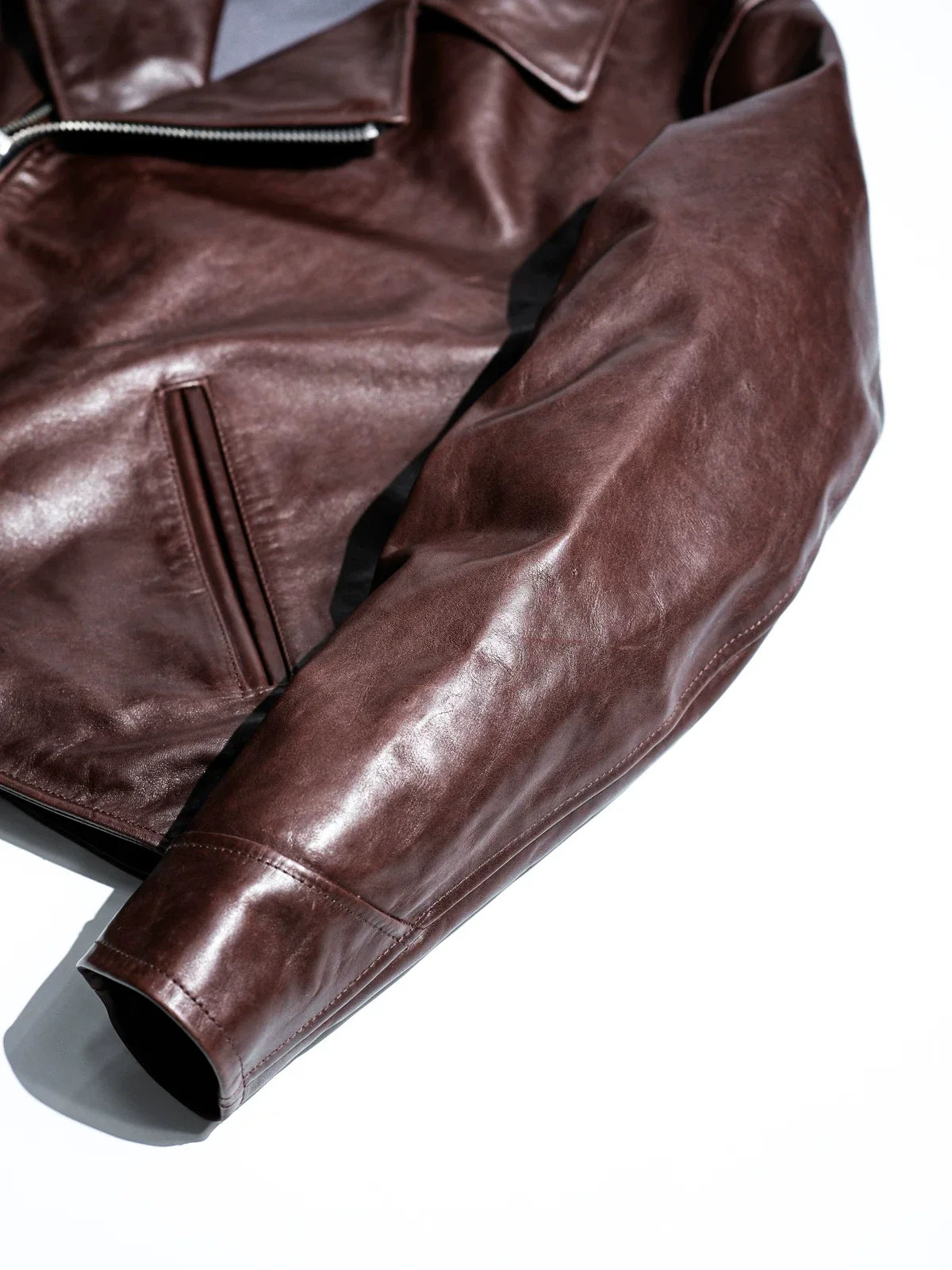 Sleeve panel construction and natural patina on seal brown water-dyed horsehide