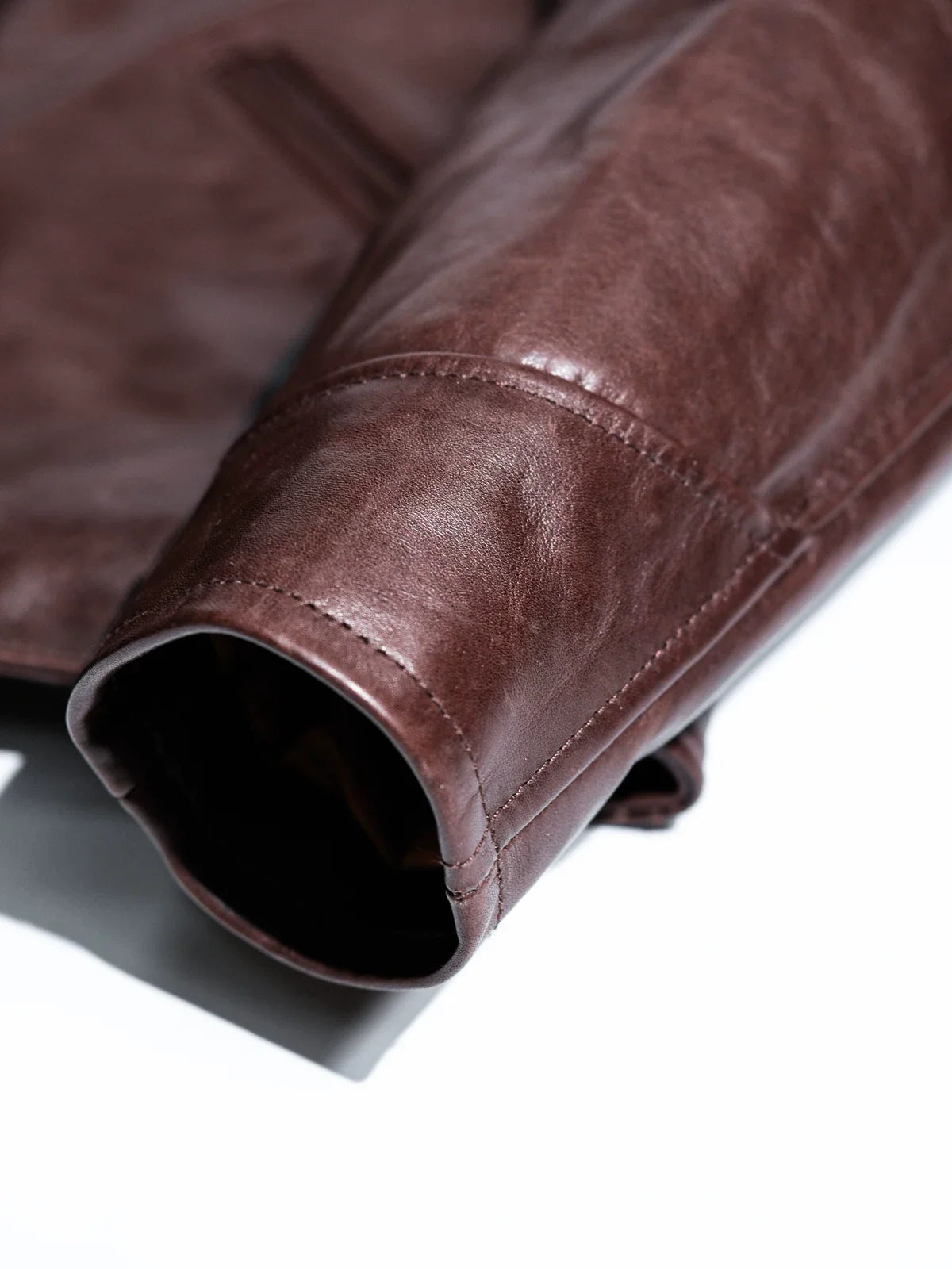 Interior of sleeve cuff showing lining and neat stitching on seal brown horsehide