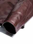 Interior of sleeve cuff showing lining and neat stitching on seal brown horsehide