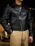 Three-quarter side view of black tea-core horsehide double-breasted jacket worn open