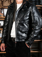 Black beltless moto jacket upper front worn with henley shirt