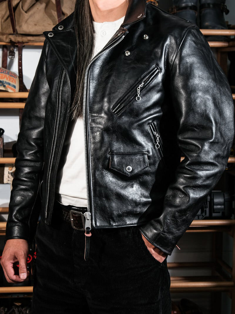 Black beltless moto jacket upper front worn with henley shirt