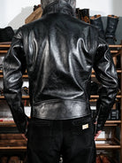 Back view of black beltless horsehide jacket with corduroy pants