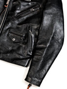 Black jacket front panel detail with zip and snap pockets