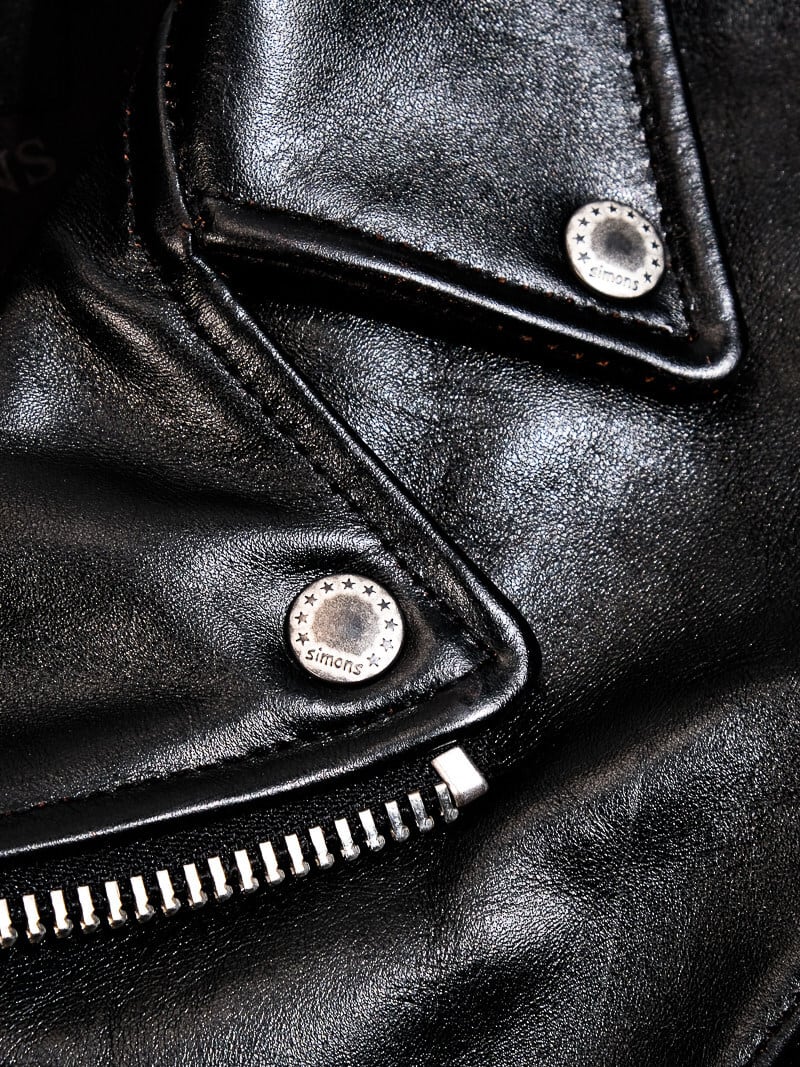 Custom 10-star SIMONS snap buttons on the black horsehide jacket