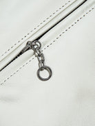 White jacket pocket zipper with chain pull and ring